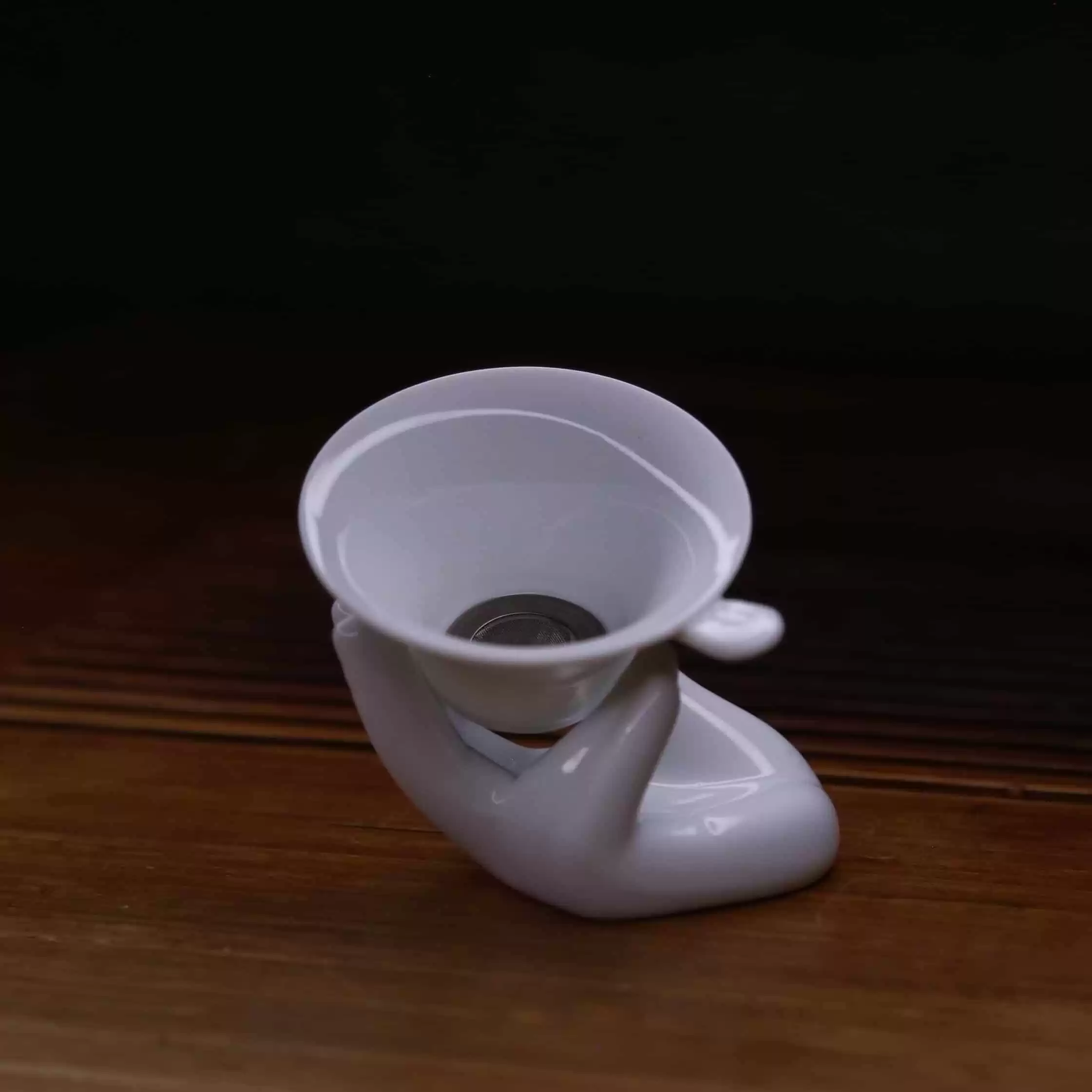 Unique Tea Strainer Hand Holding Cup